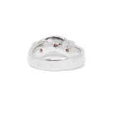 Silver ring with embedded stones on a white background