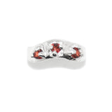 Silver ring with red gemstones on top view