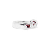 Silver ring with a red sapphires left view