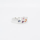 Silver ring with colorful stone on a white background