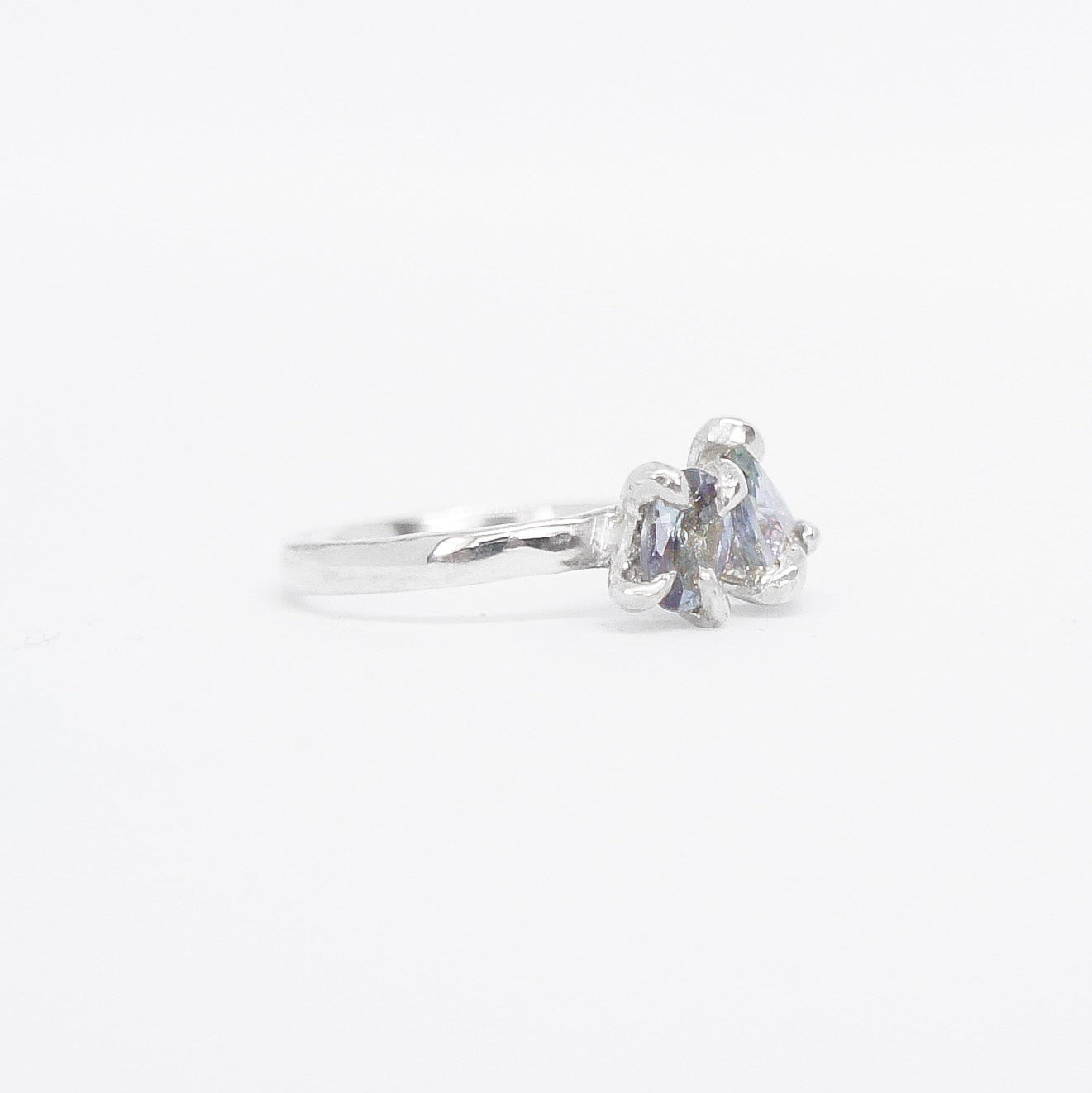 Silver ring toi et moi design with gemstone on a white background