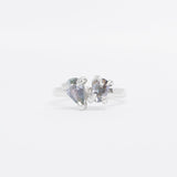 Silver ring toi et moi design with gemstone on a white background