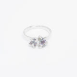 Silver ring toi et moi design with gemstone on a white background