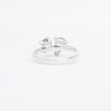 Silver ring toi et moi design with gemstone on a white background