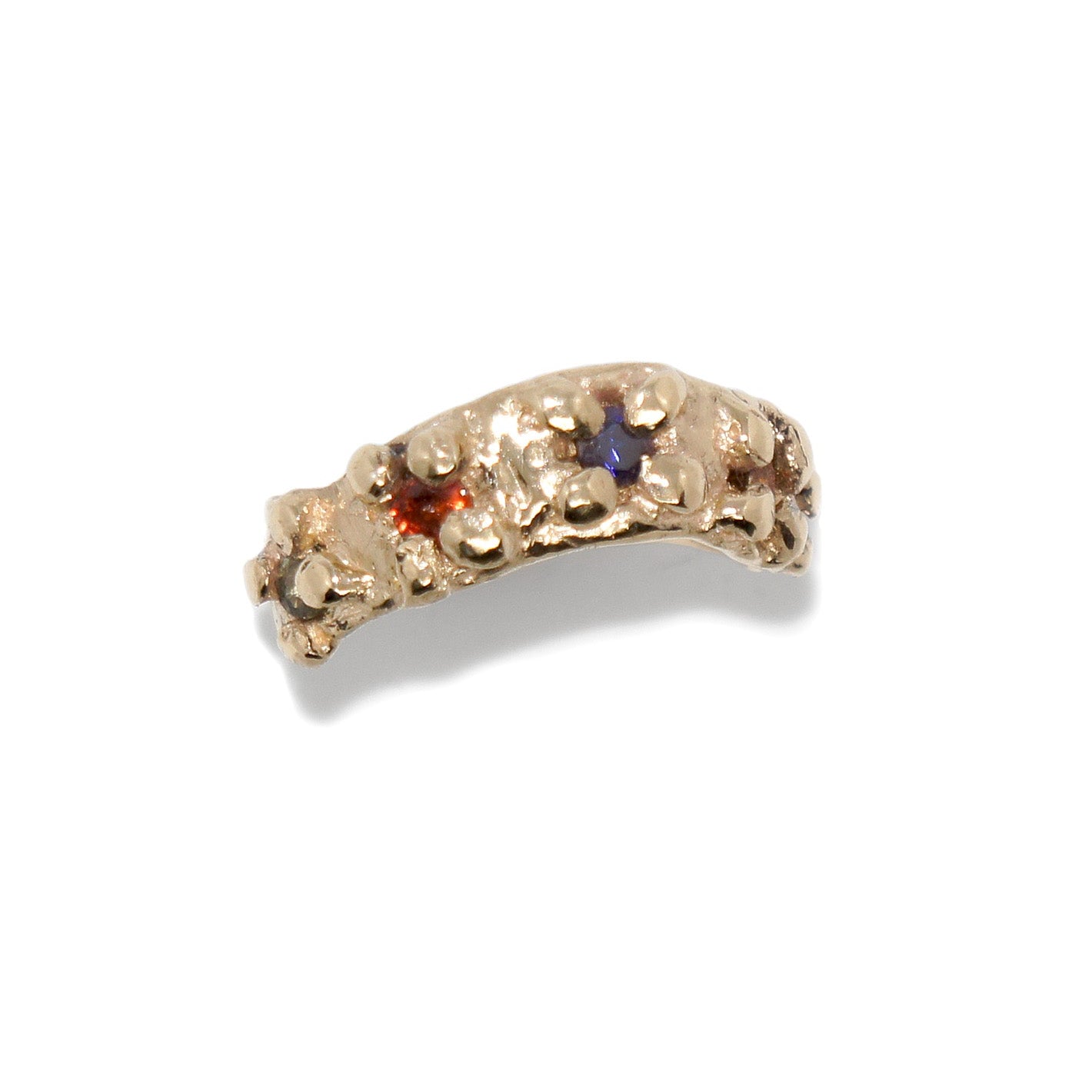 Gold ring with embedded gemstones on a white background