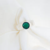 Green gemstone earring on a white background