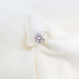 Close-up of a diamond earring on a white background