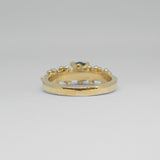 Gold ring with a green gemstone