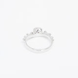 Silver ring with a small stone on a white background