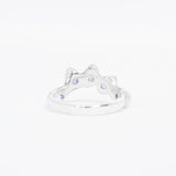 Silver ring with small stones on a white background