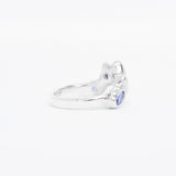 Silver ring with blue gemstone on a white background