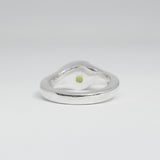 Silver ring with a green gemstone