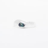 Silver ring with a blue gemstone on a white background