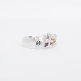 Silver ring with colourful stones charms on a white background