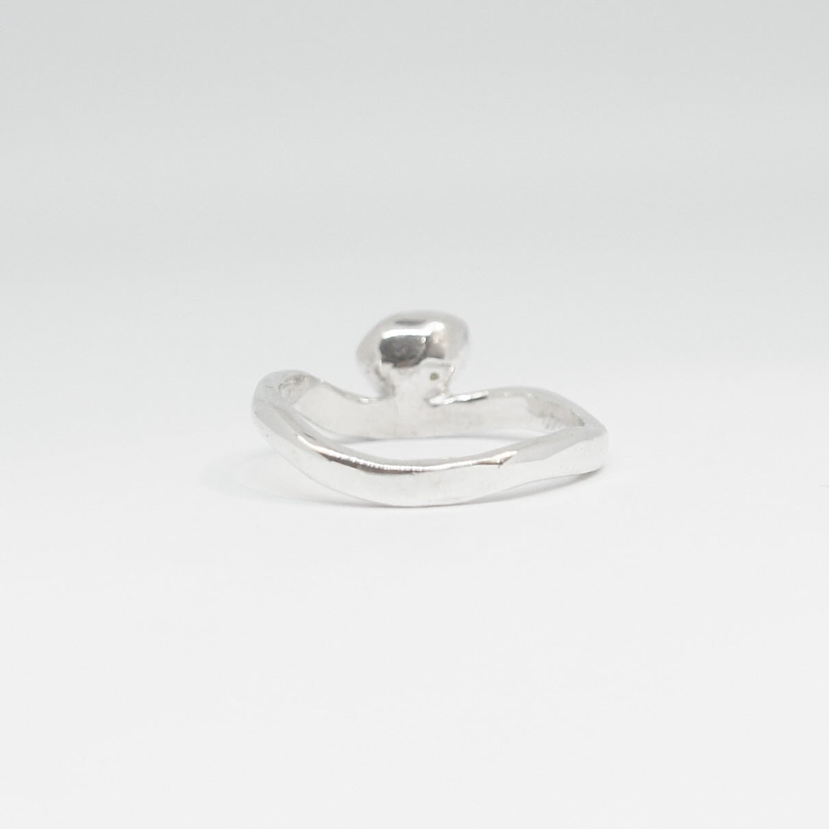Silver ring on a white background