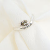 Close-up of a decorative brooch on a white background