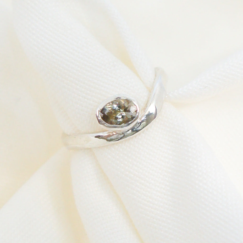 Close-up of a decorative brooch on a white background