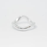 Silver ring on a light gray background