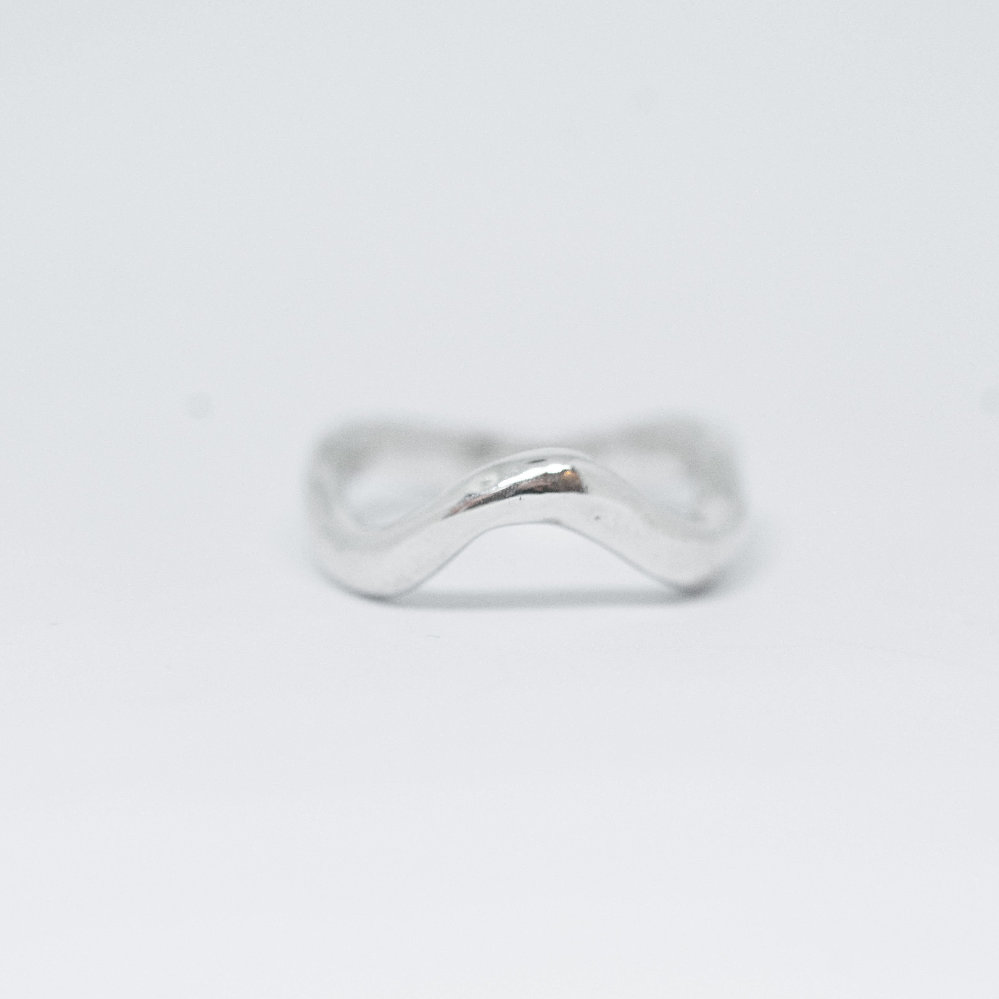 Silver ring on a white background